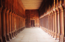 a hallway and rows of columns 