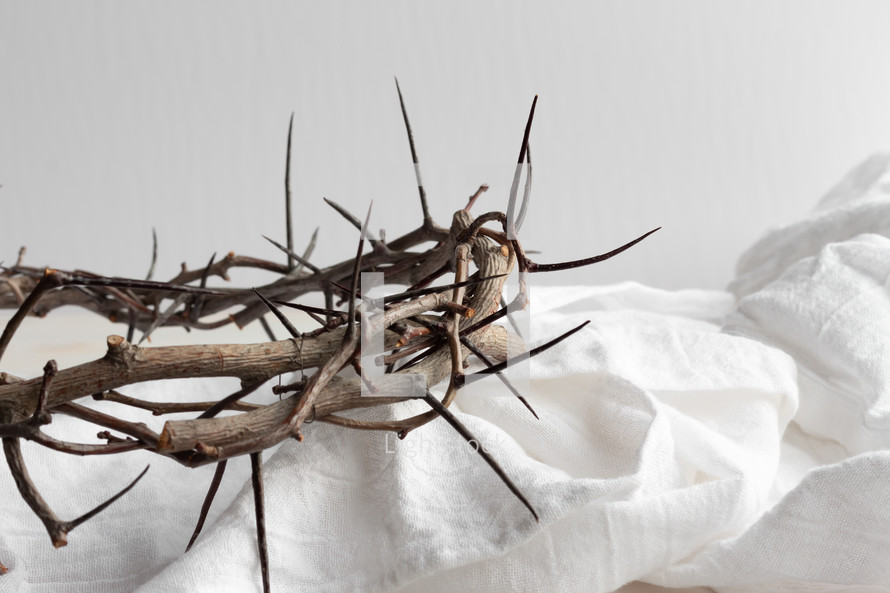 crown of thorns on white linen 