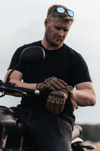 Man in black t-shirt riding a motorcycle, motorbike rider