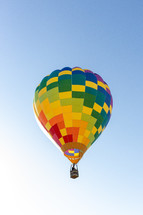 hot air baloon in a blue sky 