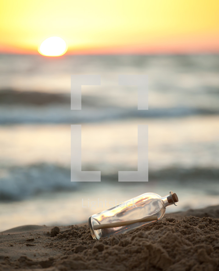 message in a bottle on a beach 
