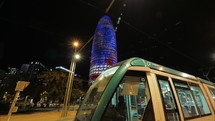Night timelapse of Barcelona with illuminated Torre Agbar, Spain