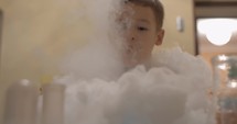 Child is happy to play with liquid nitrogen white smoke