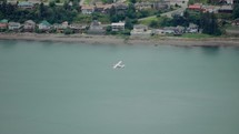 Airplane flying over water in Juneau, Alaska