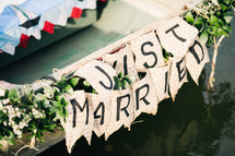 just married on the back of a row boat 