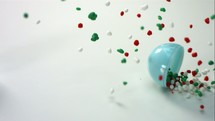 slow motion candy spilling from a bowl 