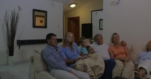 Family spending leisure with TV