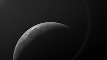 Waning Crescent Moon Against Dark Surface. extreme closeup	
