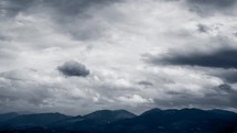 dark clouds over mountains 