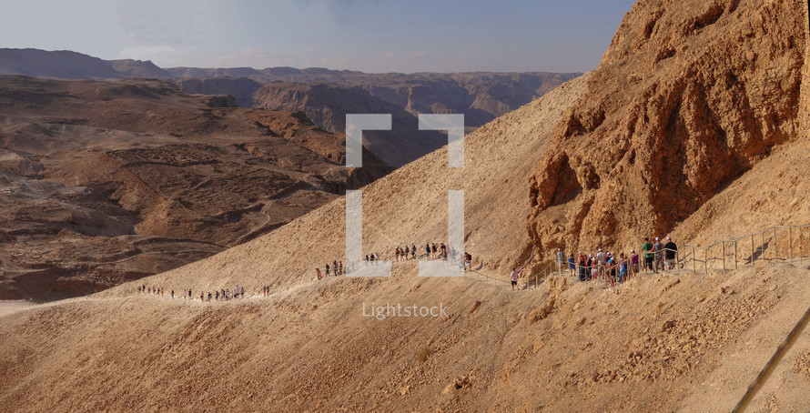 Tourists walking down from the Fortress of Masada, Israel. 