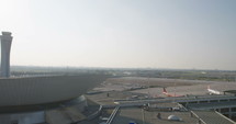 Overview of a large airport with planes and terminals