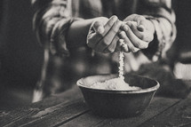 cupped hands holding rice 