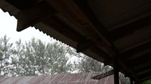 heavy rain falling on a school house roof in Kenya 
