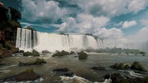 Largest Waterfalls Of Iguazu Falls In Southern Brazil Under Cloudscape. Low Wide Shot