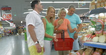 Family buying cheese in the store