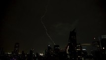 Sky with dark clouds and lightning. A large rain cloud with thunderstorms with lightning. Night stormy sky above city. 