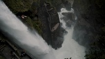 Tourists Visiting The Devil's Cauldron Waterfall In Baños de Agua Santa, Ecuador - drone	