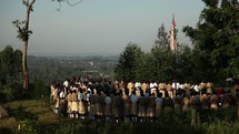 school assembly and songs around a flag pole in Kenya 