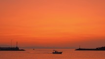 Evening marine scene with sailing motor boats