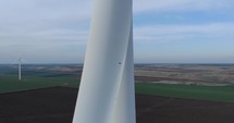 Close Up Aerial View of Wind Turbine Blades Rotating for green energy production.