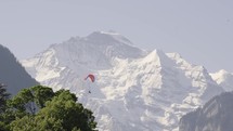 Paraglider in front of mountains