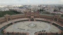 Spain Square or Plaza de Espana and Maria Luisa Park at Seville in Spain. Aerial backward