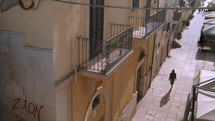 Girl walking in the streets of Italy