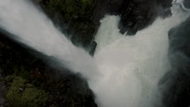 Cascada de río Verde - Pailon del Diablo Waterfall Fast-flowing Water Gushing Down To The River In Baños de Agua Santa, Ecuador.