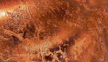 abstract background of copper colored rough and smooth textures
