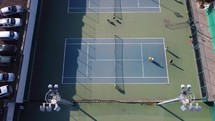 Tennis players on courts
