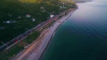 Aerial View of a Coastal Train Journey in Russia 4K Drone Shot