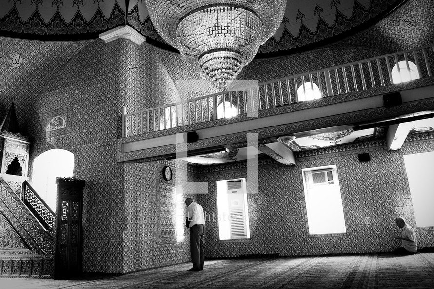 man in prayer inside a mosque