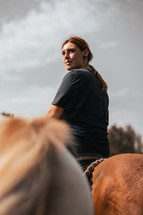 Woman riding a horse in summer, horseback photo