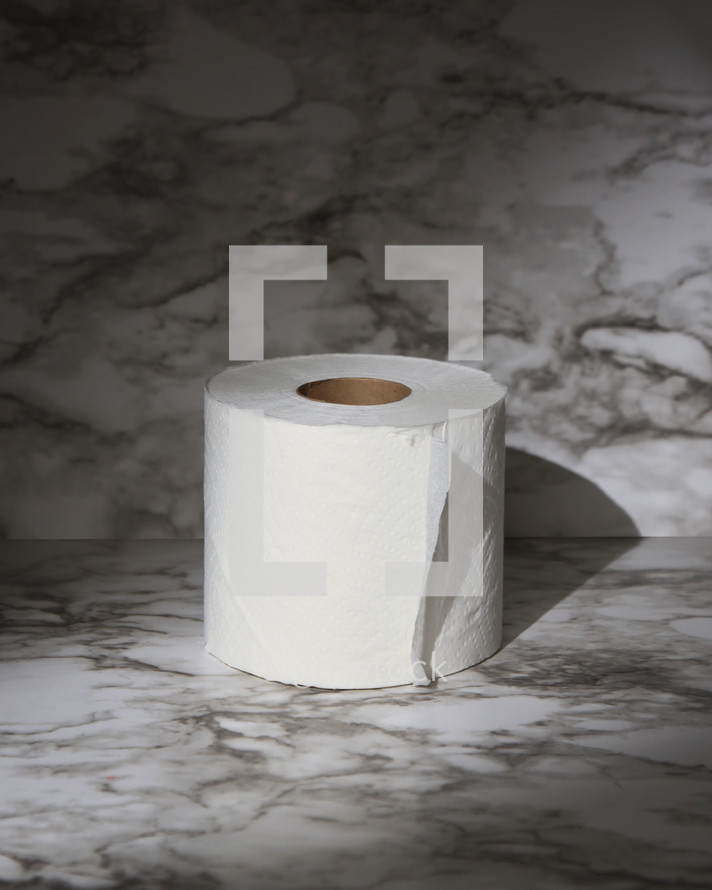 toilet paper on marble background 