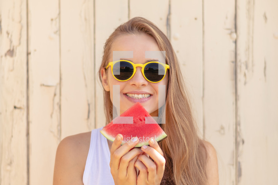 young woman eating watermelon 