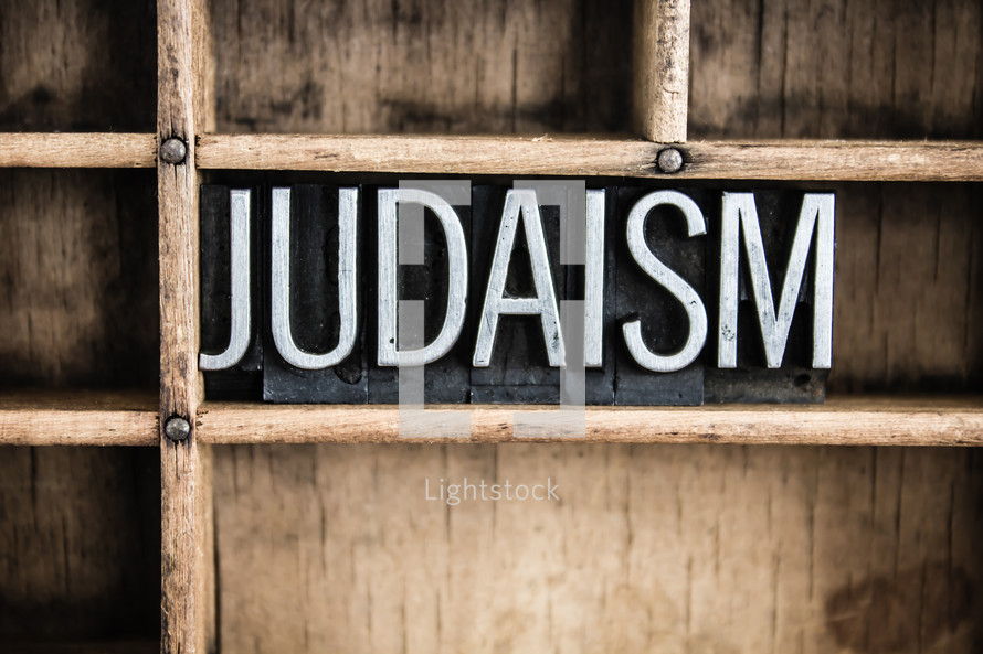 word Judaism in blocks on a bookshelf 