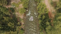 aerial view over white water rafters 