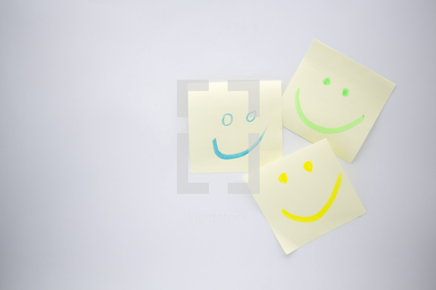 smiley faces on sticky notes 