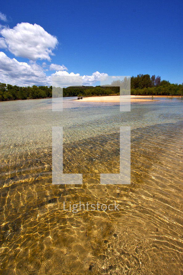 shallow water along a beach shore 