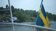 Swedish flag, on a boat in Stockholm looking out at the islands.