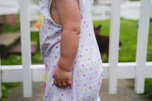 a toddler girl in a nightgown 
