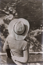 a woman in a hat on cruise ship 