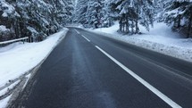 Road In A Winter Scenery - tilt up shot