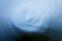 abstract swirling blue and black water-like background 