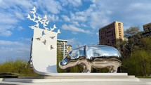 Hippo mirror statue in the park time-lapse