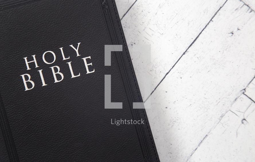 Bible on a white wood background 