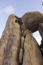 a man climbing a rock 