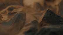 Rough abstract wet stones rotating with a foggy atmosphere around them 
