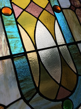 angled view of stained glass window panel closeup 