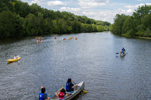 canoes and kayaks on a river 
